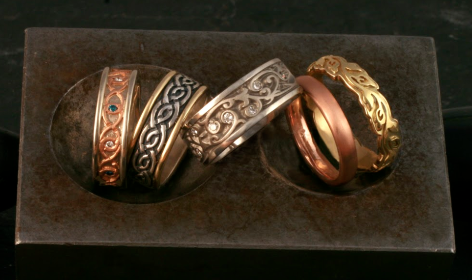 An assortment of designer men's comfort fit wedding bands. Any of our rings can be made as a comfort fit ring.